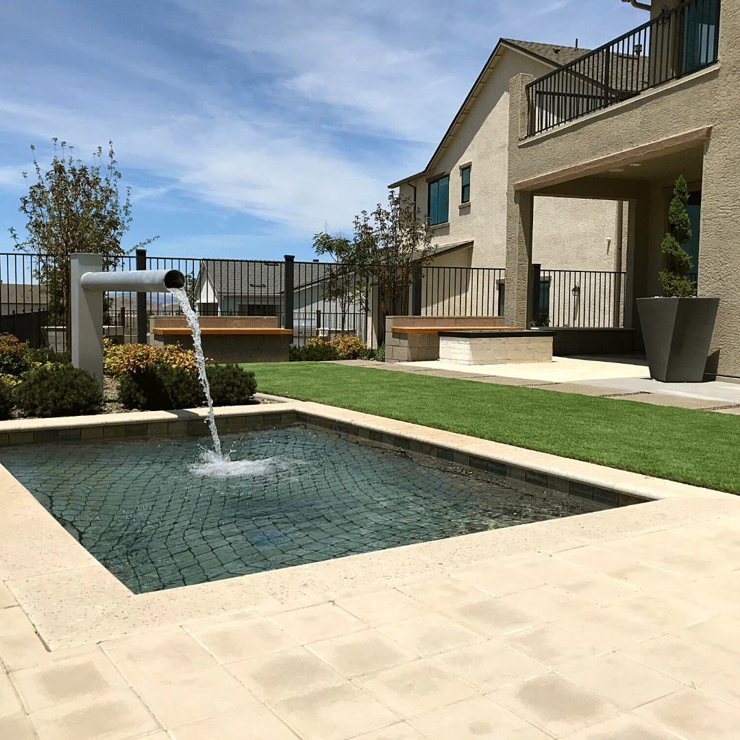 backyard outdoor living water feature artificial turf